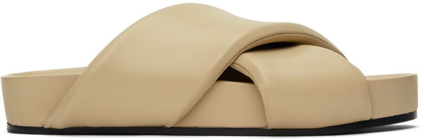 Бежевые стеганые шлепанцы Jil Sander
Бежевые стеганые шлепанцы Jil Sander