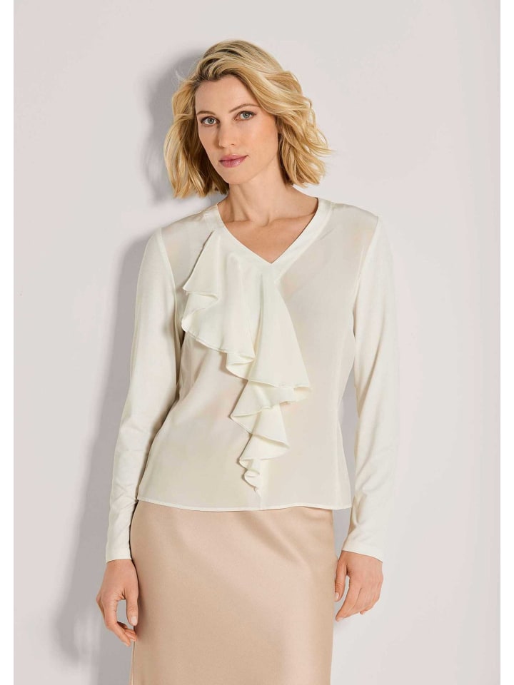 MADELEINE Элегантная шелковая блузка с V-образным вырезом кремового цвета
MADELEINE Элегантная шелковая блузка с V-образным вырезом кремового цвета