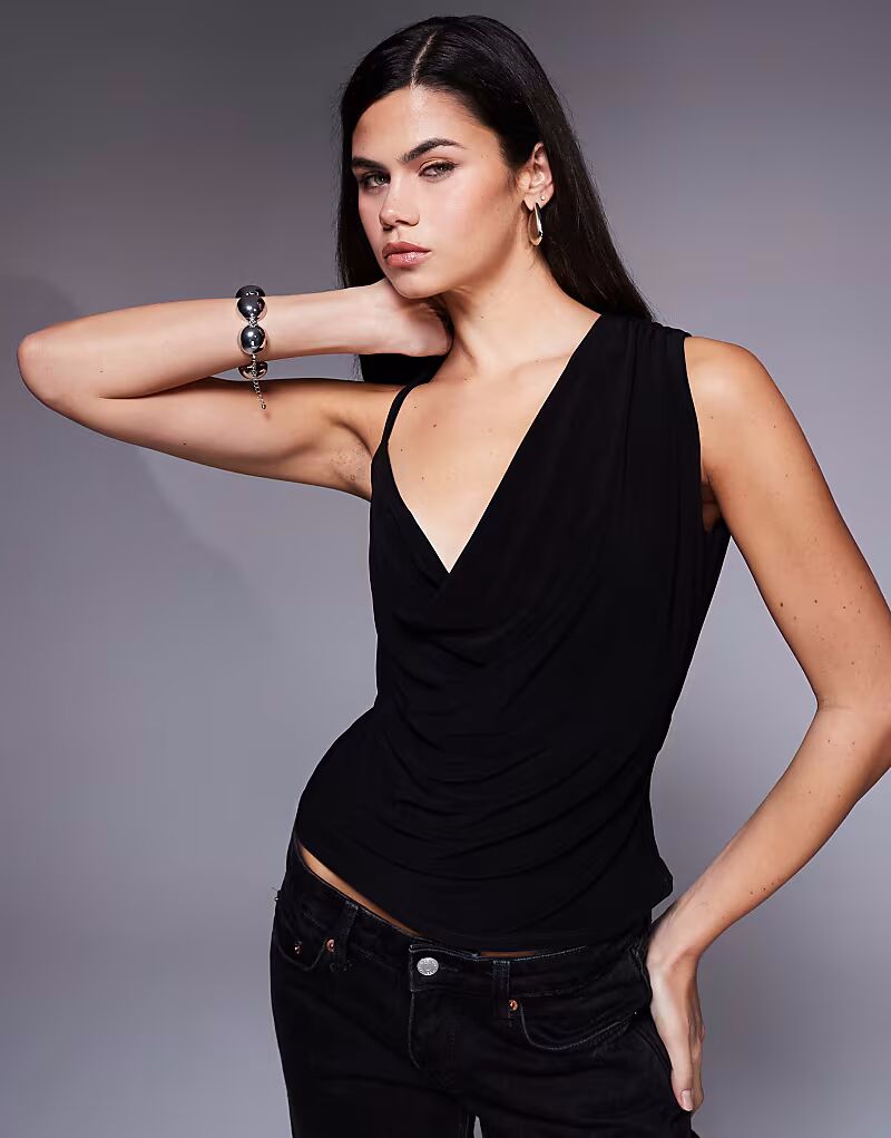 Облегающий асимметричный топ с воротником-хомутом черного цвета Asos Design
Облегающий асимметричный топ с воротником-хомутом черного цвета Asos Design