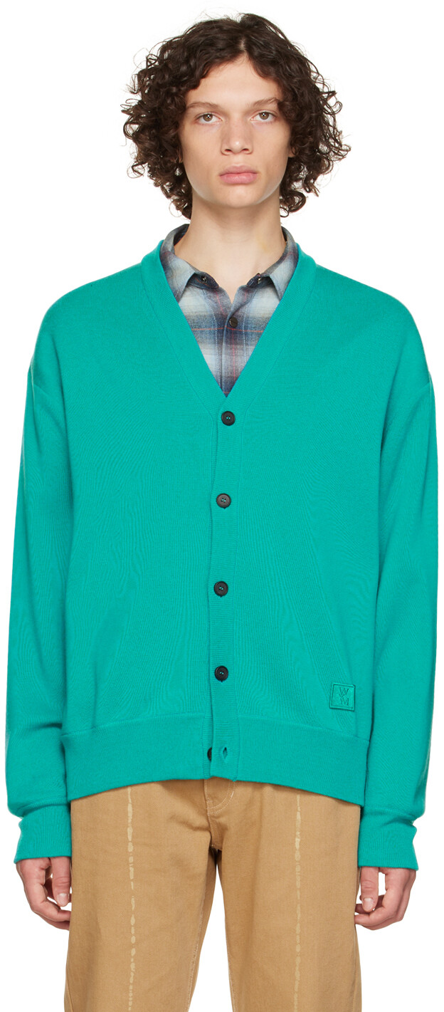 Синий кожаный кардиган с лейблом Wooyoungmi
Синий кожаный кардиган с лейблом Wooyoungmi