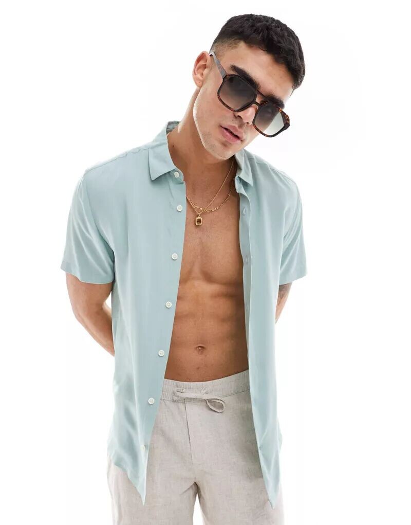 Зеленая вискозная рубашка стандартного кроя с короткими рукавами ASOS
Зеленая вискозная рубашка стандартного кроя с короткими рукавами ASOS