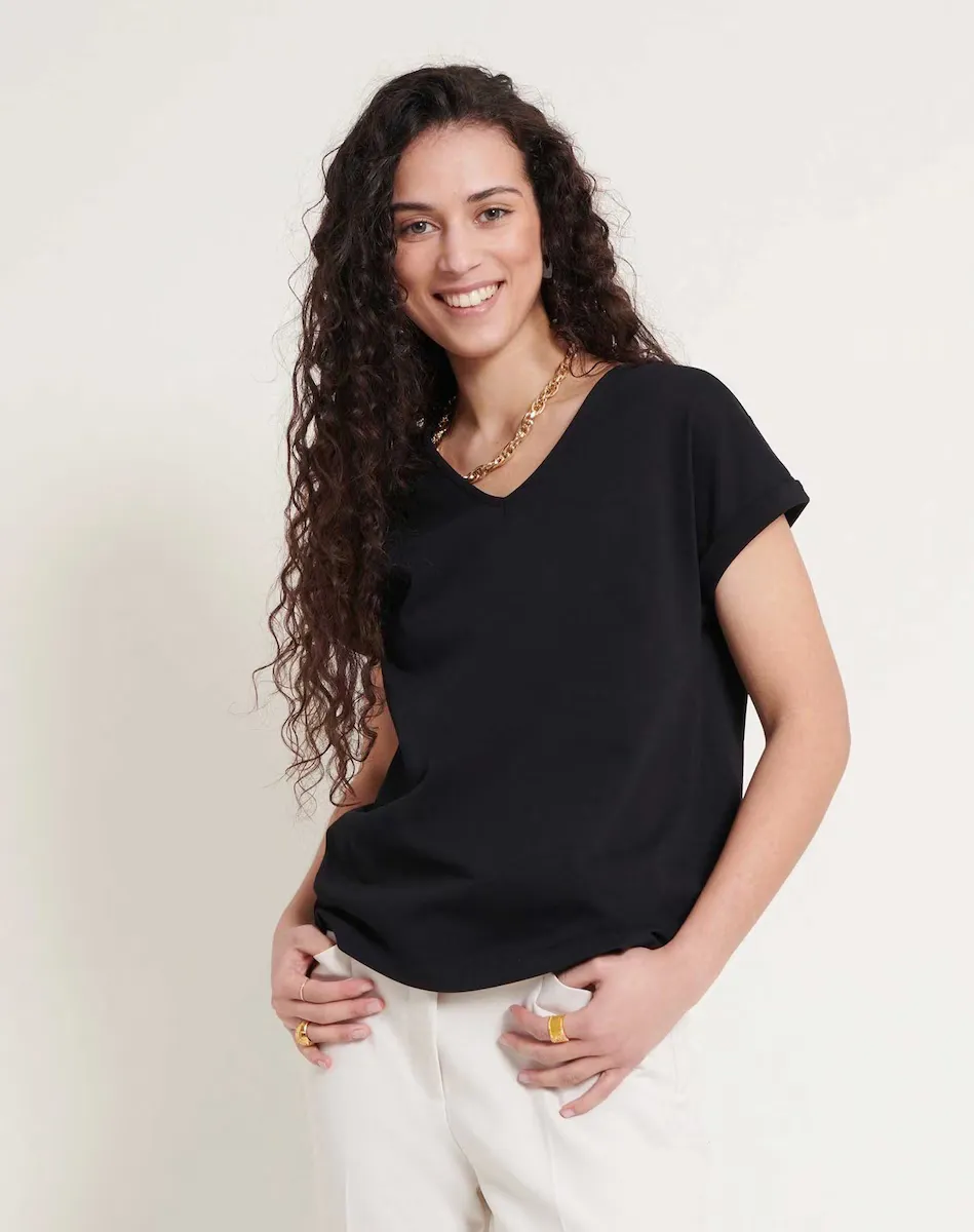 Женская футболка с V-образным вырезом и приспущенными рукавами Naf Naf, черный
Женская футболка с V-образным вырезом и приспущенными рукавами Naf Naf, черный