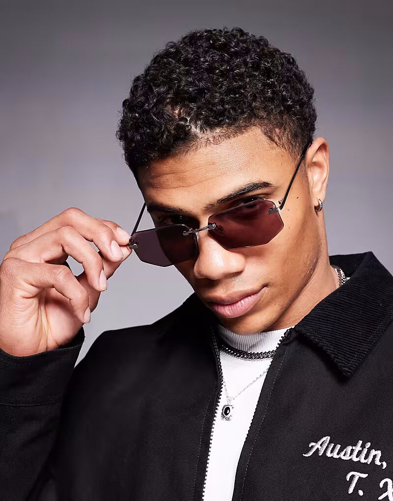 Солнцезащитные очки ASOS DESIGN в стиле 90-х годов без оправы из металла серебристого цвета с прямоугольными линзами бордового цвета
Солнцезащитные очки ASOS DESIGN в стиле 90-х годов без оправы из металла серебристого цвета с прямоугольными линзами бордового цвета