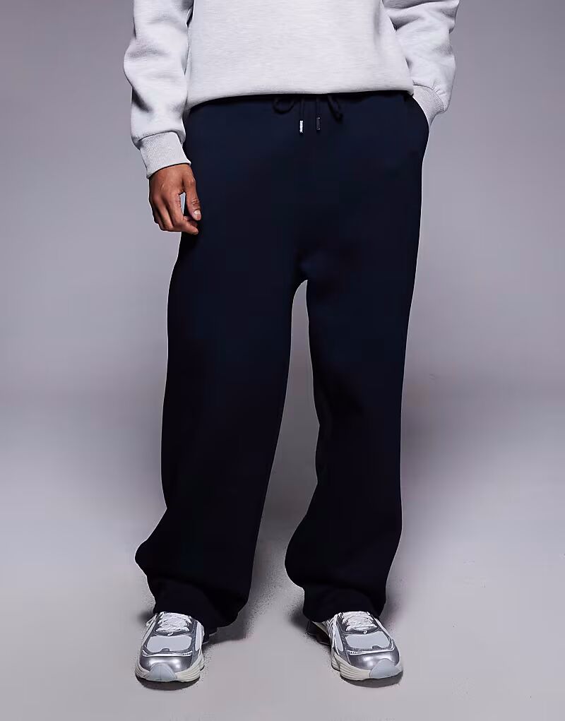 Плотные широкие брюки-джоггеры из ткани в стиле «скуба» темно-синего цвета Asos Design
Плотные широкие брюки-джоггеры из ткани в стиле «скуба» темно-синего цвета Asos Design