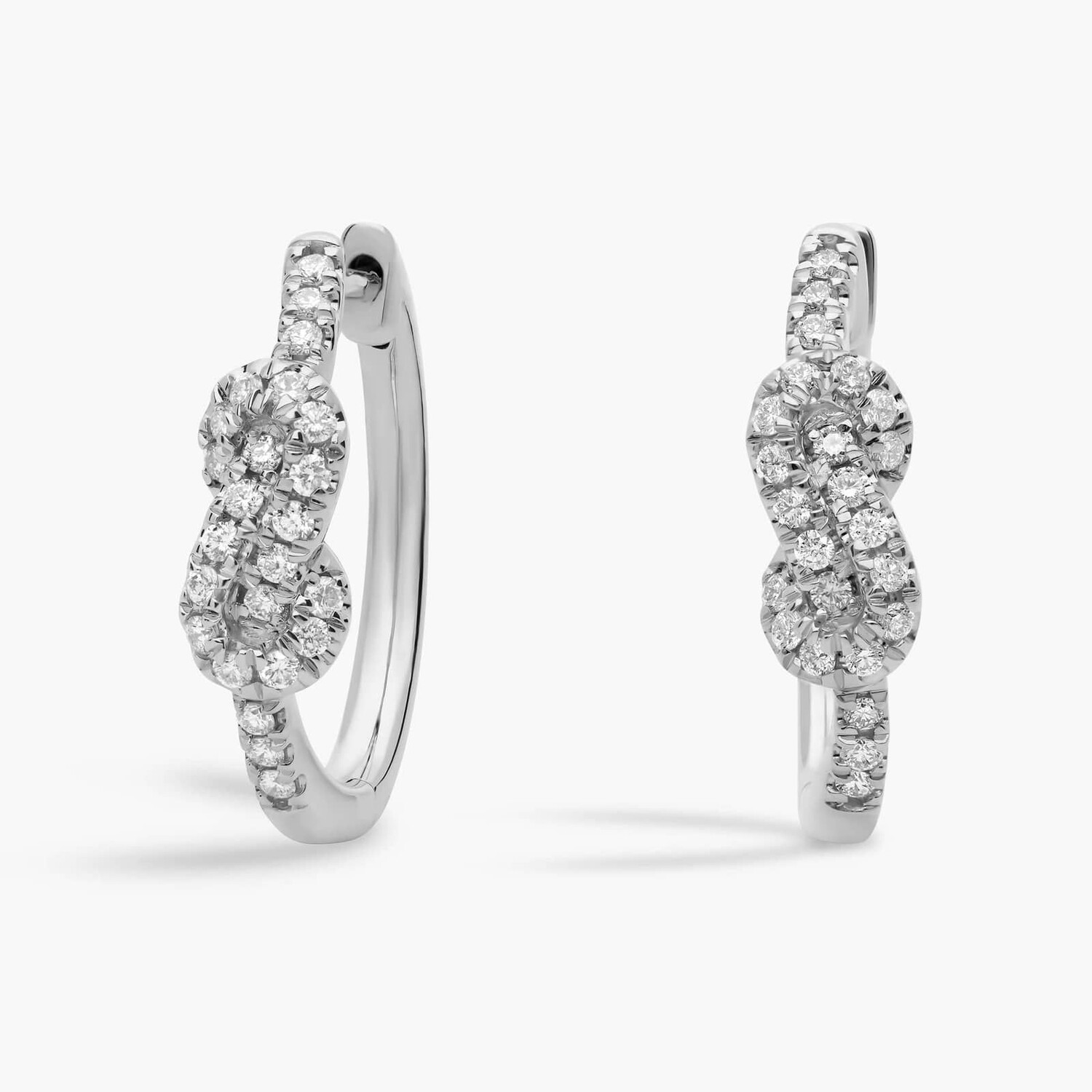 Серьги-кольца в форме узла из 14-каратного белого золота (1/3 карата). Blue Nile
Серьги-кольца в форме узла из 14-каратного белого золота (1/3 карата). Blue Nile