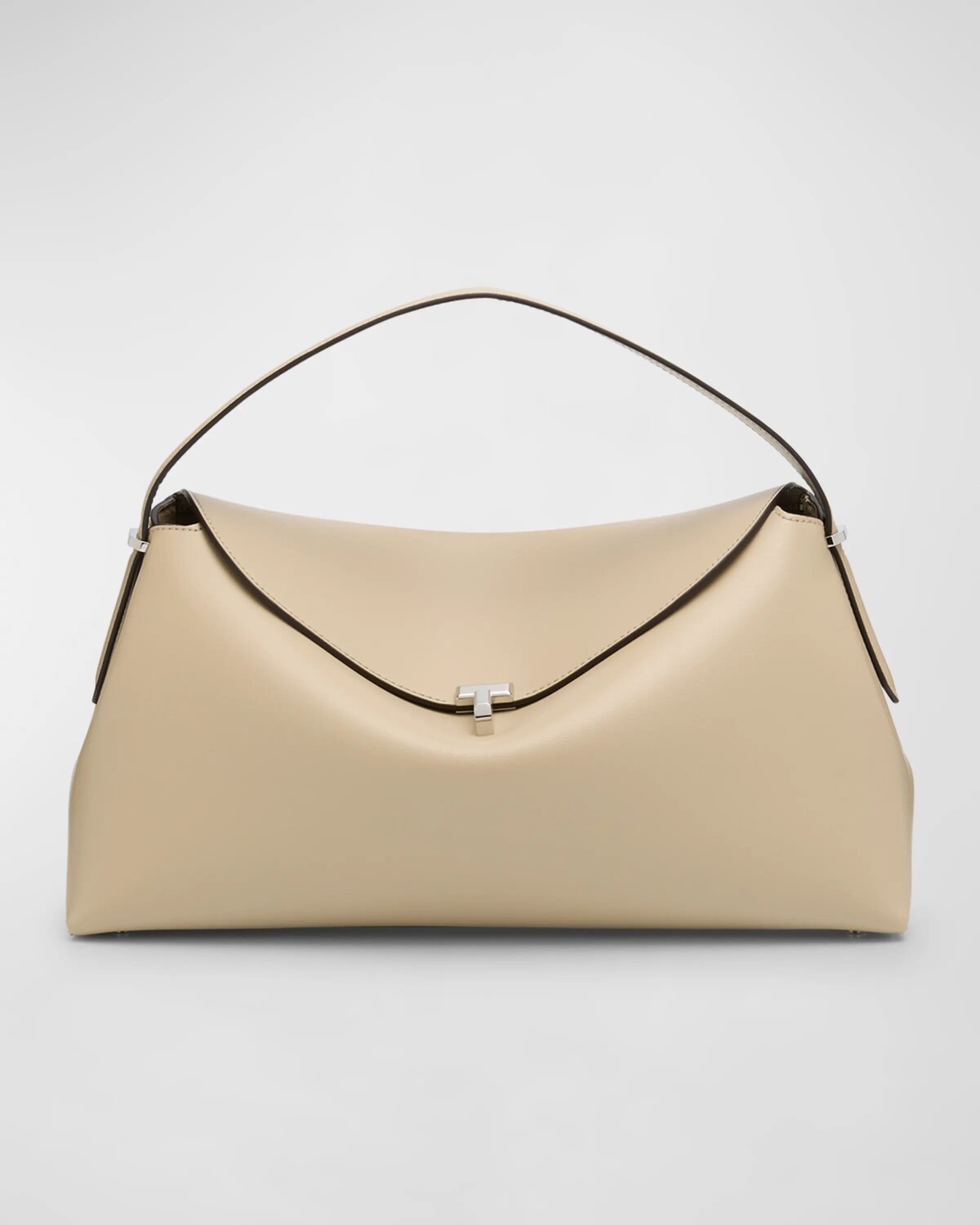 Кожаная сумка с T-образным замком и верхней ручкой Toteme, цвет Fawn
Кожаная сумка с T-образным замком и верхней ручкой Toteme, цвет Fawn