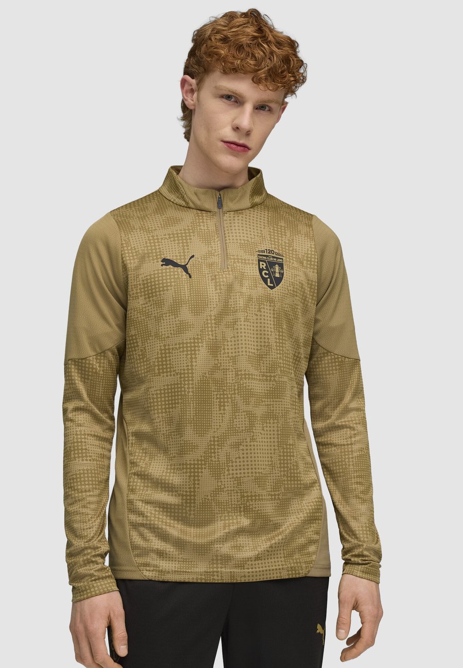Топ Puma RC LENS, Matte Gold- Black/Khaki
Топ Puma RC LENS, Matte Gold- Black/Khaki
