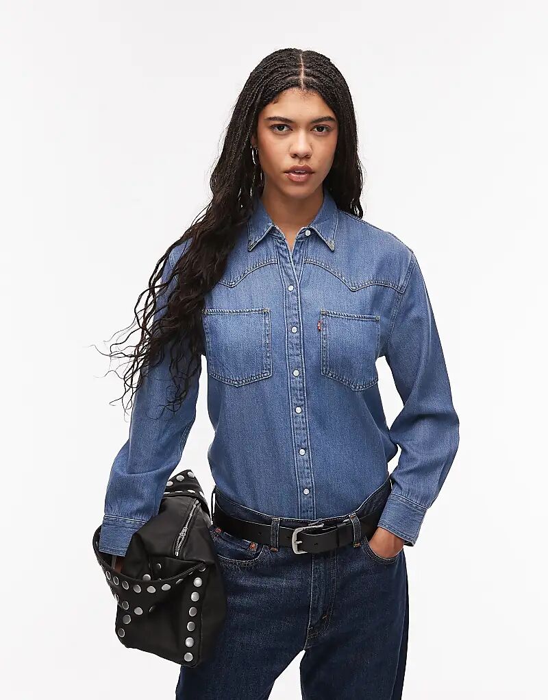 Рубашка из денима Levi's Teodora в стиле вестерн, средне-синего цвета
Рубашка из денима Levi's Teodora в стиле вестерн, средне-синего цвета