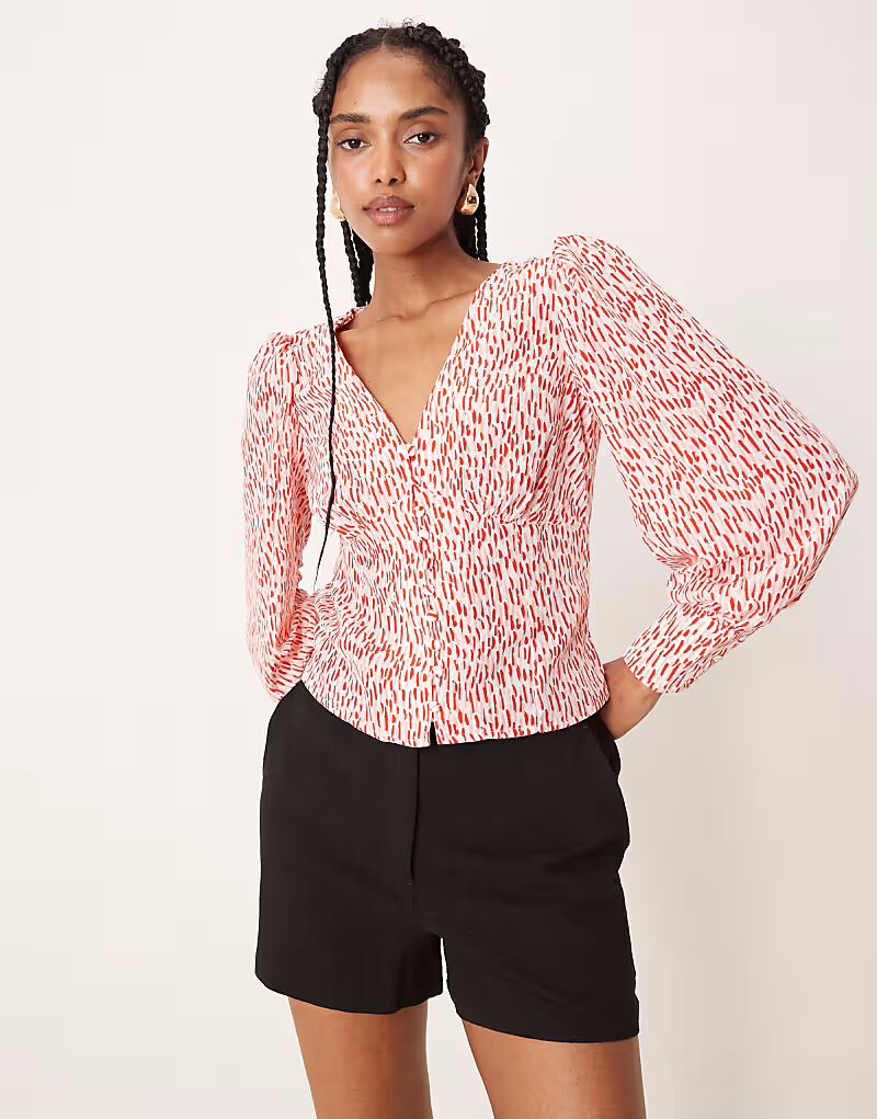 Гламурная блузка с V-образным вырезом и пуговицами спереди в бело-красном принте Glamorous
Гламурная блузка с V-образным вырезом и пуговицами спереди в бело-красном принте Glamorous