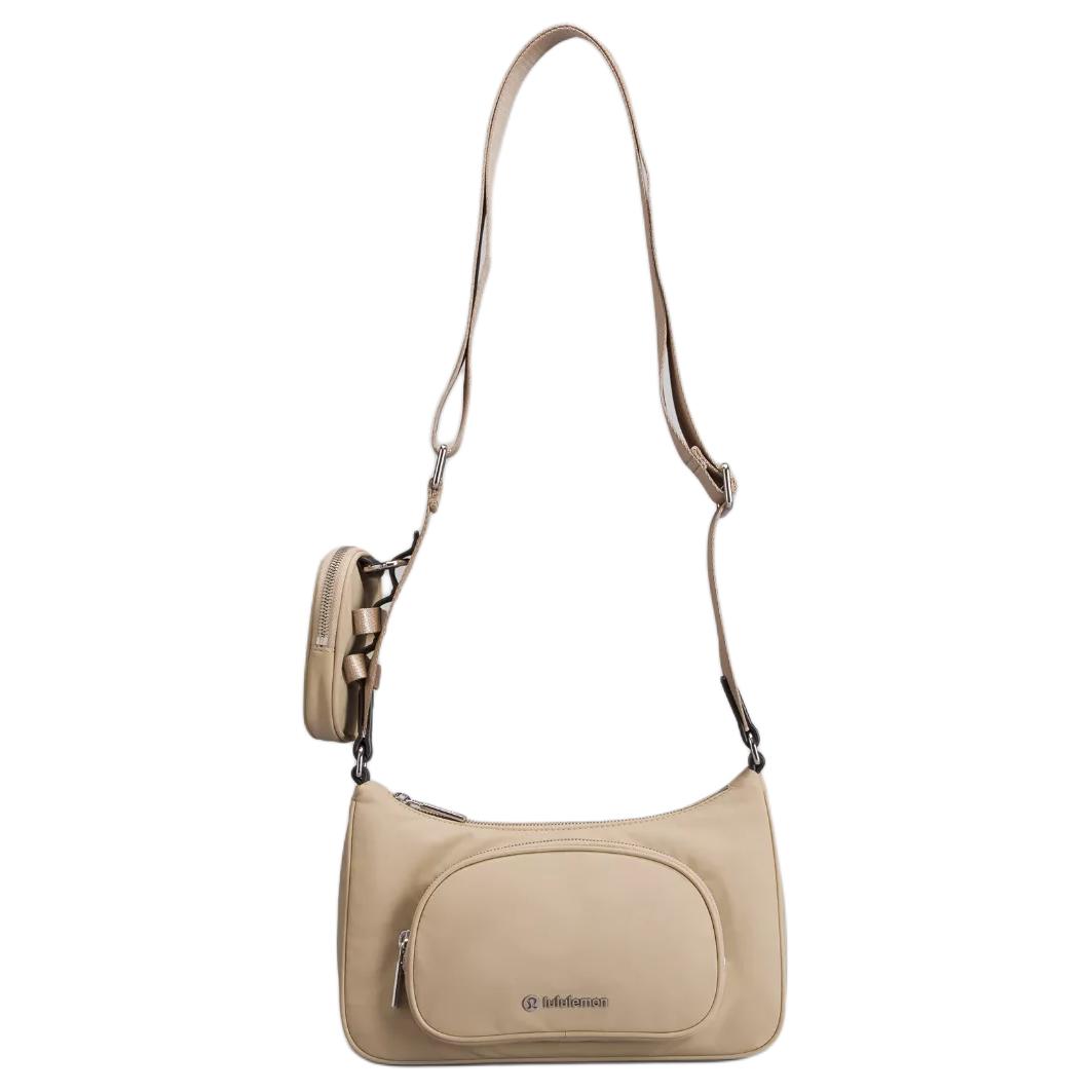 Lululemon Женская сумка через плечо из переработанного нейлона бежевая, Beige
Lululemon Женская сумка через плечо из переработанного нейлона бежевая, Beige