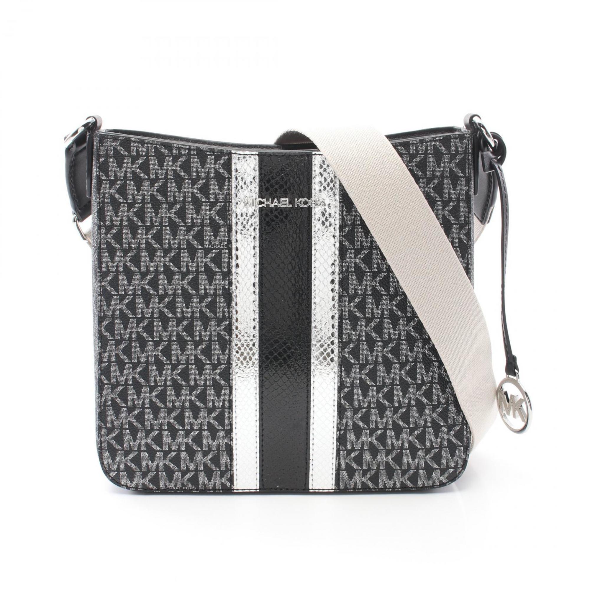 Michael Kors Jet Set Дорожная сумка через плечо из кожи с покрытием Canvas Сумка на выходные, черный/серебряный
Michael Kors Jet Set Дорожная сумка через плечо из кожи с покрытием Canvas Сумка на выходные, черный/серебряный