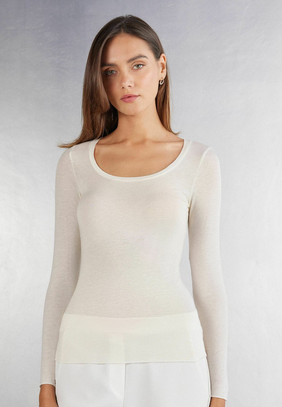 Топ Intimissimi Long sleeved top, Elfenbein Natural Vanilla/White
Топ Intimissimi Long sleeved top, Elfenbein Natural Vanilla/White