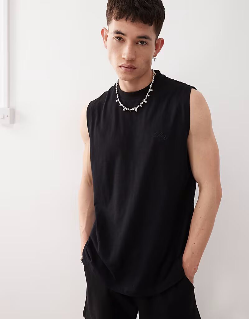 Майка свободного кроя из джерси Reclaimed Vintage из джерси с заниженной проймой черного цвета
Майка свободного кроя из джерси Reclaimed Vintage из джерси с заниженной проймой черного цвета