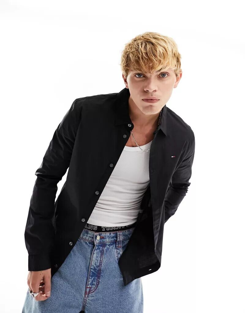 Черная узкая эластичная рубашка приталенного кроя Tommy Jeans
Черная узкая эластичная рубашка приталенного кроя Tommy Jeans