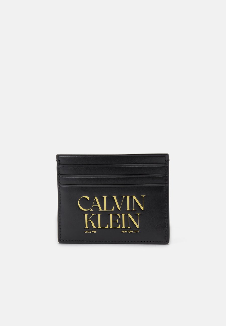 Кошелек Calvin Klein GRAPHIC CARD CASE, Black
Кошелек Calvin Klein GRAPHIC CARD CASE, Black