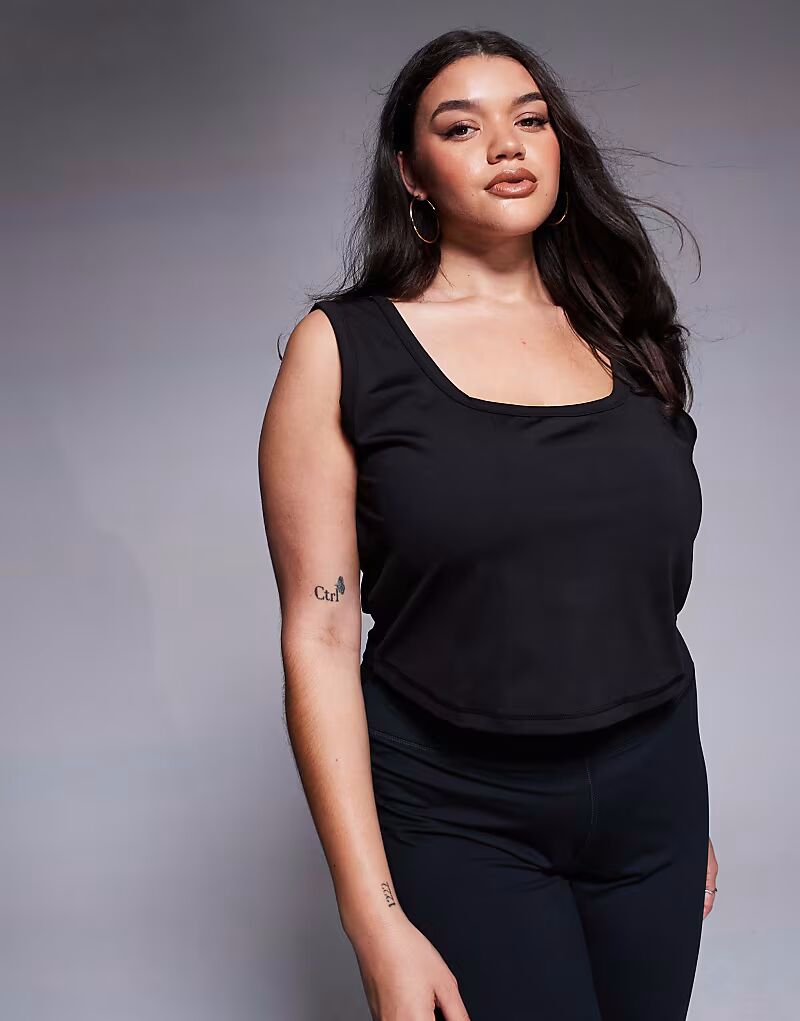 Слегка укороченный тренировочный топ с круглым вырезом, черного цвета 4505
Слегка укороченный тренировочный топ с круглым вырезом, черного цвета 4505