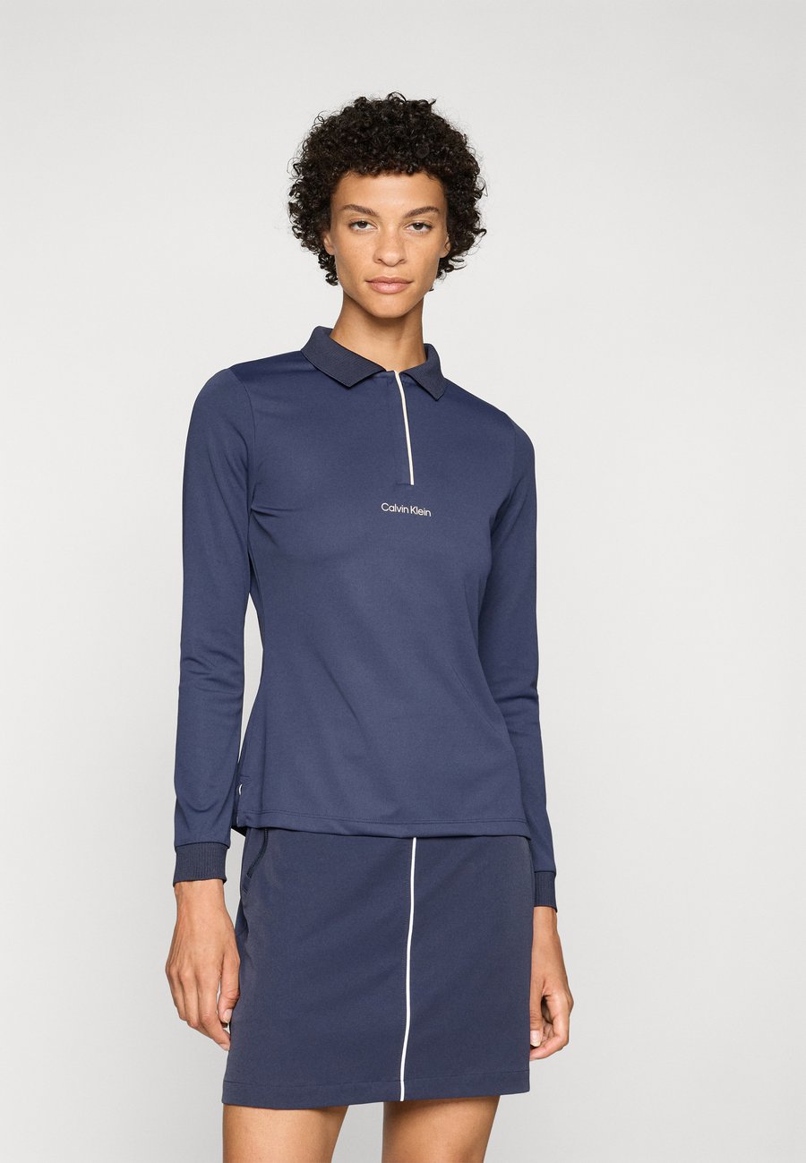 Поло Calvin Klein Golf MILA LONG SLEEVE , Navy/Royal Blue
Поло Calvin Klein Golf MILA LONG SLEEVE , Navy/Royal Blue