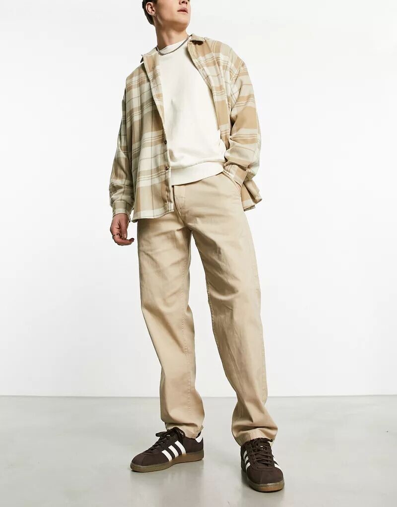 Бежевые брюки чинос свободного кроя Jack & Jones Intelligence Kane
Бежевые брюки чинос свободного кроя Jack & Jones Intelligence Kane