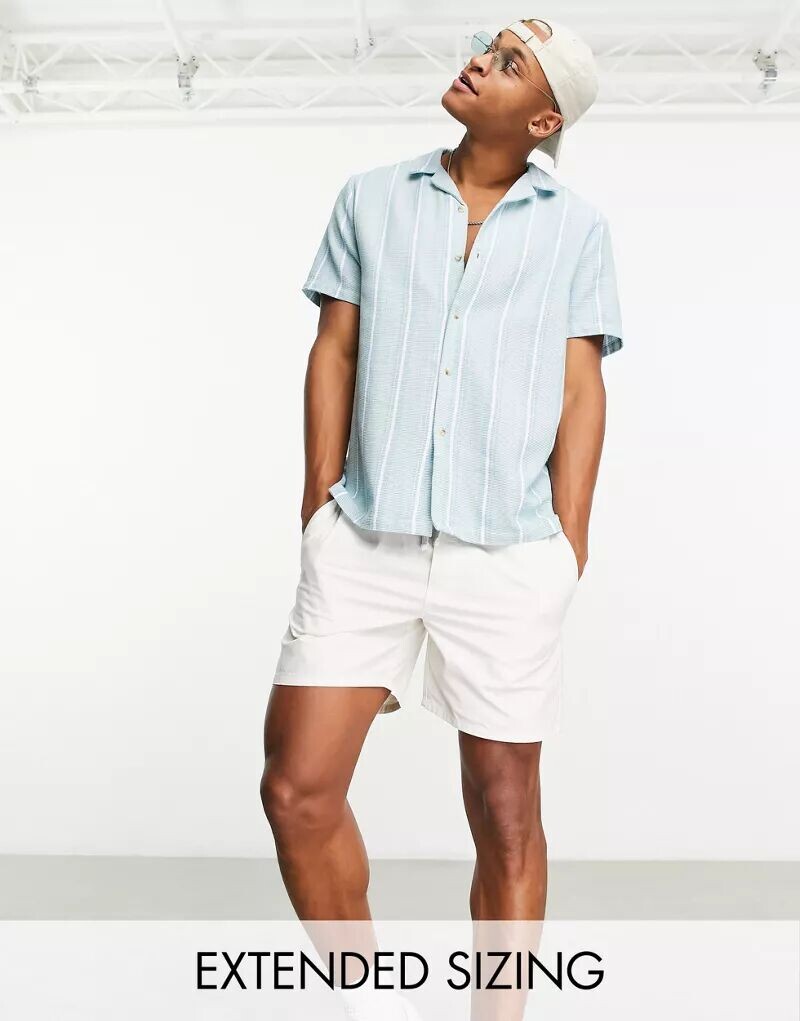 Синяя рубашка свободного кроя с фактурными полосками и воротником с лацканами ASOS
Синяя рубашка свободного кроя с фактурными полосками и воротником с лацканами ASOS