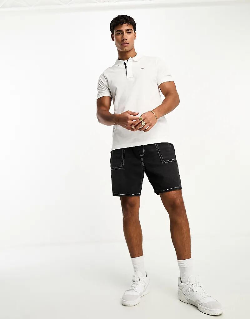 Рубашка поло с короткими рукавами и узкой планкой белого цвета Tommy Jeans
Рубашка поло с короткими рукавами и узкой планкой белого цвета Tommy Jeans