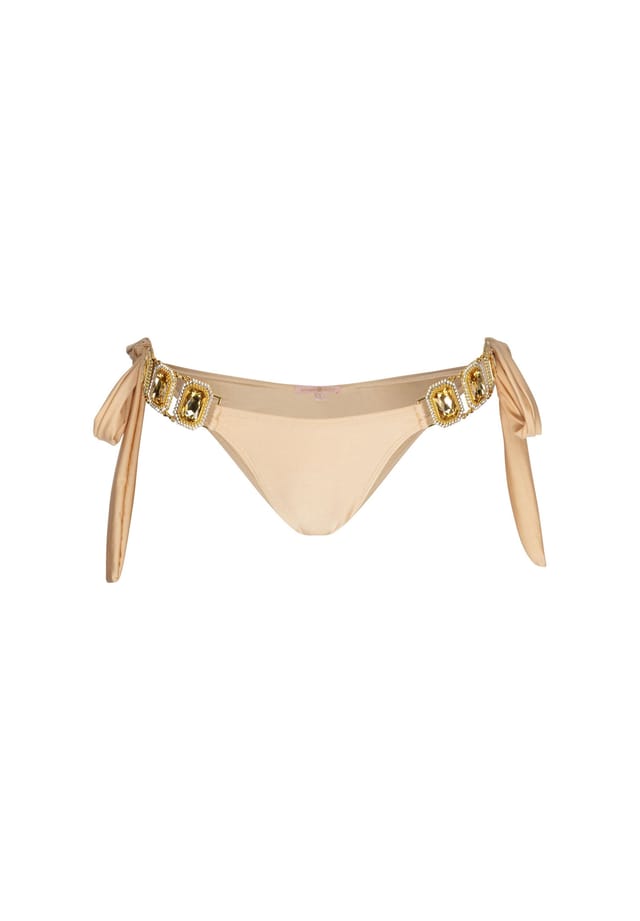 Плавки бикини в бразильском стиле Boujee с завязками по бокам и стильной отделкой камнями Moda Minx, цвет champagne
Плавки бикини в бразильском стиле Boujee с завязками по бокам и стильной отделкой камнями Moda Minx, цвет champagne
