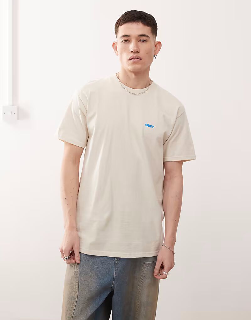 Футболка с графическим логотипом Obey и принтом на спине кремового цвета
Футболка с графическим логотипом Obey и принтом на спине кремового цвета
