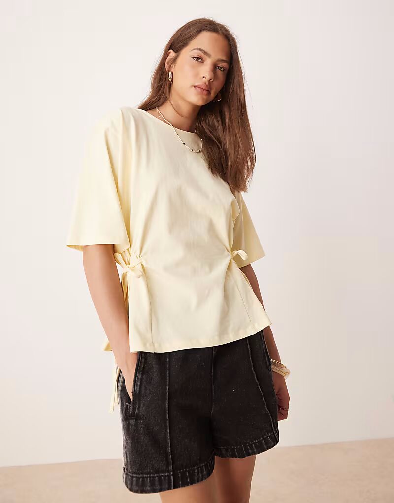 Футболка свободного кроя ASOS DESIGN лимонного цвета с завязкой
Футболка свободного кроя ASOS DESIGN лимонного цвета с завязкой