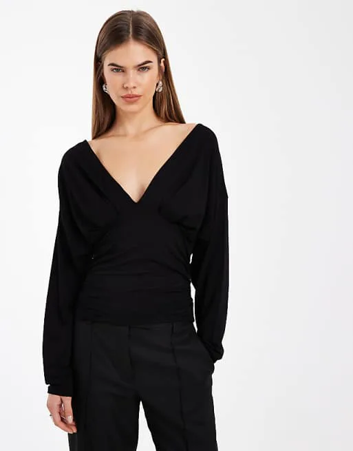 Черный топ с глубоким вырезом и застежкой-крылом летучей мыши ASOS DESIGN
Черный топ с глубоким вырезом и застежкой-крылом летучей мыши ASOS DESIGN