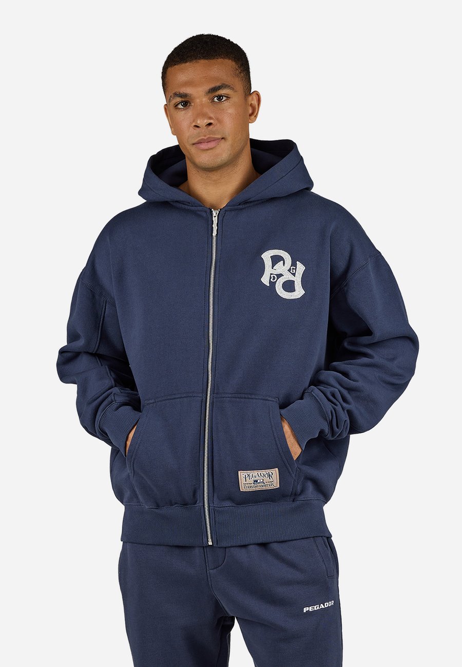 Толстовка Pegador TROPA JACKET, Washed Indigo Navy/Dark Blue
Толстовка Pegador TROPA JACKET, Washed Indigo Navy/Dark Blue