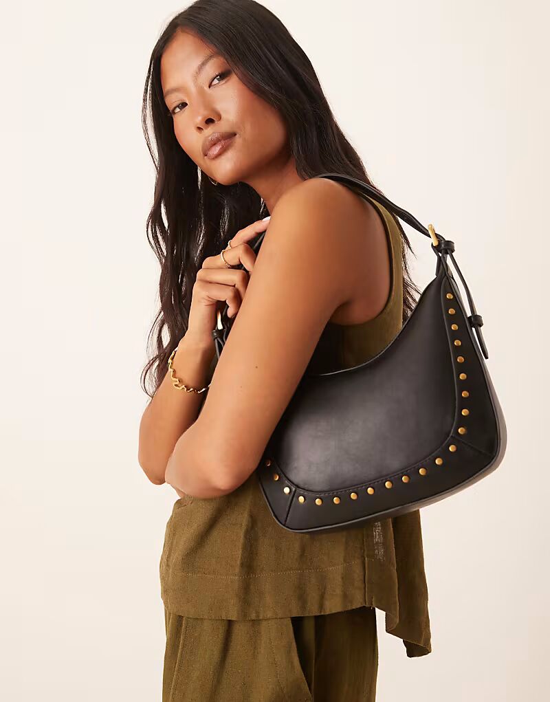 Сумка через плечо Mango с золотыми заклепками черного цвета
Сумка через плечо Mango с золотыми заклепками черного цвета