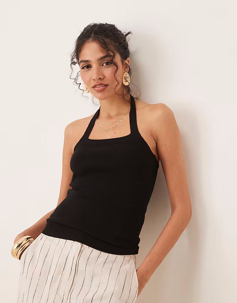 Вязаный топ JDY с халтер-воротником черного цвета
Вязаный топ JDY с халтер-воротником черного цвета