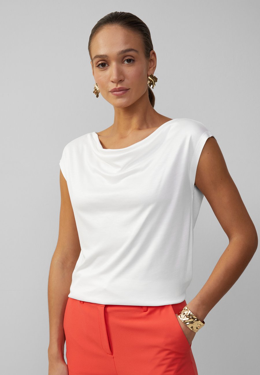 Блуза s.Oliver BLACK LABEL MIT WASSERFALL-AUSSCHNITT, Ecru/Off-White
Блуза s.Oliver BLACK LABEL MIT WASSERFALL-AUSSCHNITT, Ecru/Off-White