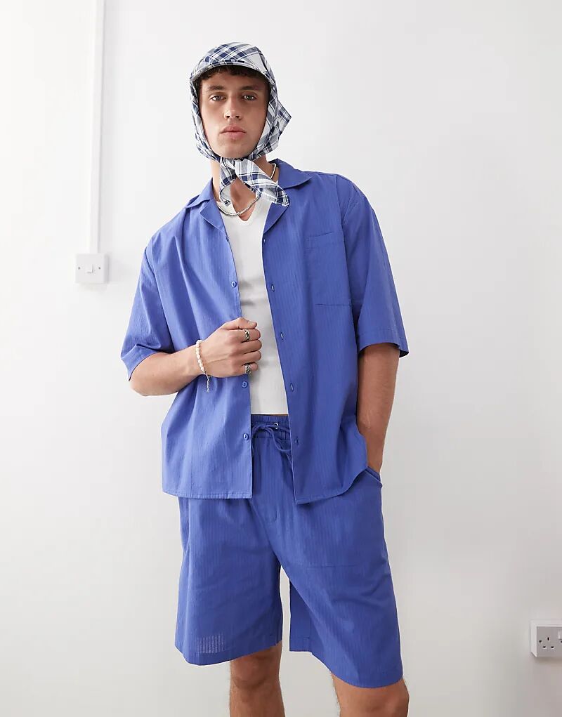 Текстурированная тканая рубашка COLLUSION в синюю полоску
Текстурированная тканая рубашка COLLUSION в синюю полоску