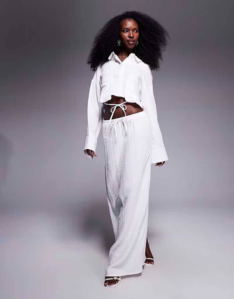 Эксклюзивная юбка-макси из текстурированного хлопка с завязками белого цвета Kaiia
Эксклюзивная юбка-макси из текстурированного хлопка с завязками белого цвета Kaiia