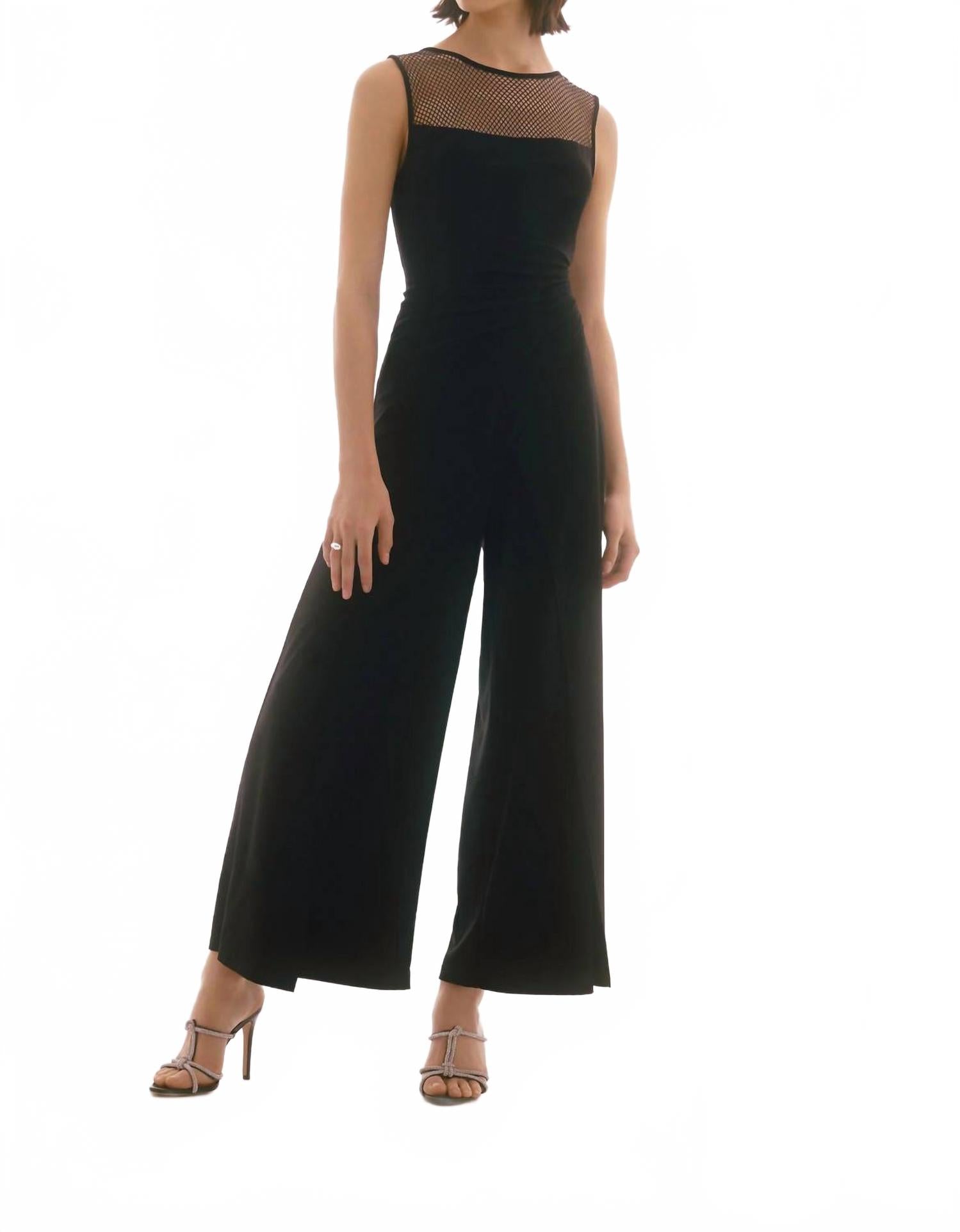 Черный комбинезон с ажурной вставкой и декором Joseph Ribkoff 
Черный комбинезон с ажурной вставкой и декором Joseph Ribkoff