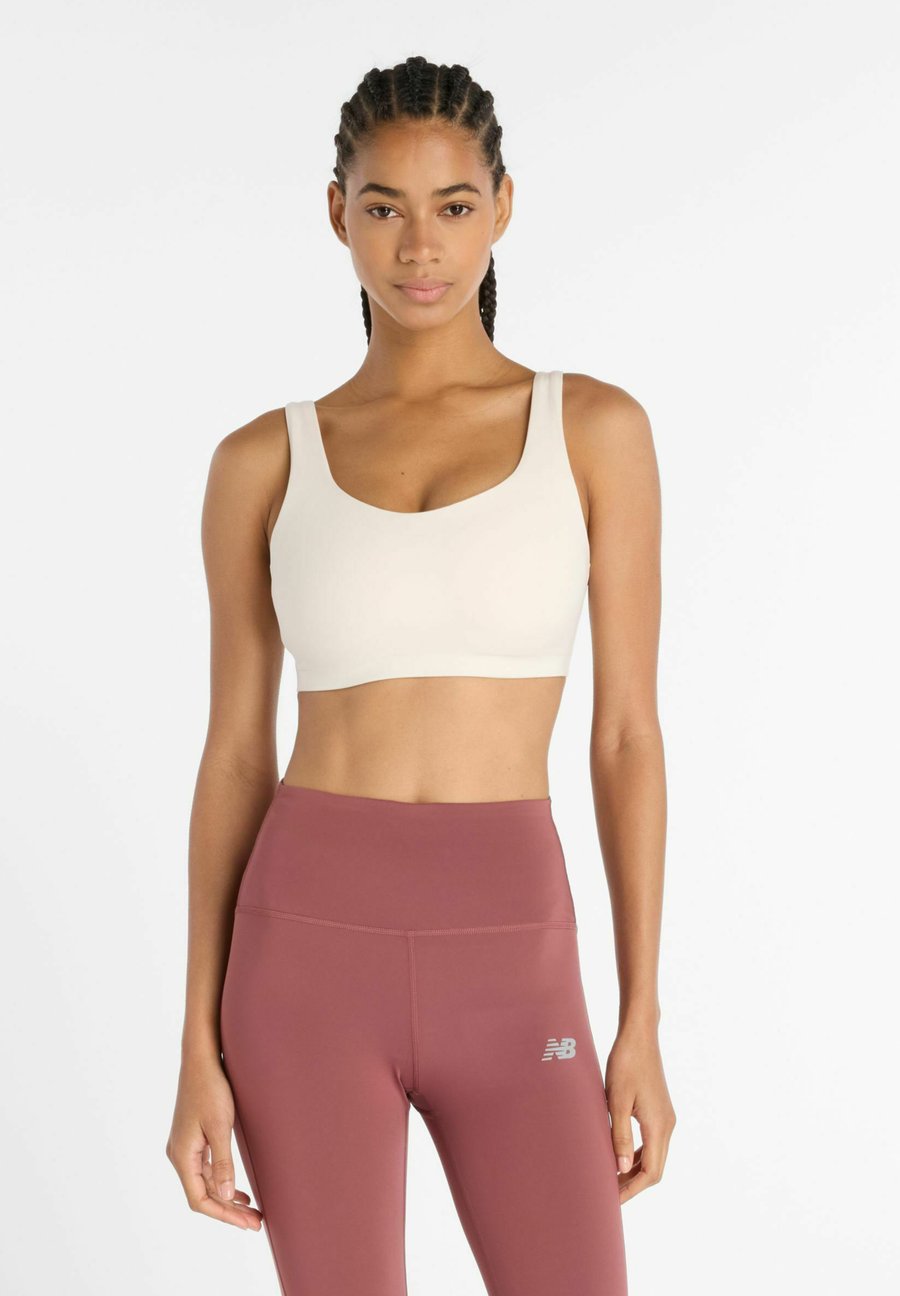 Бюстгальтер New Balance HARMONY YOGA, Linen/Beige
Бюстгальтер New Balance HARMONY YOGA, Linen/Beige