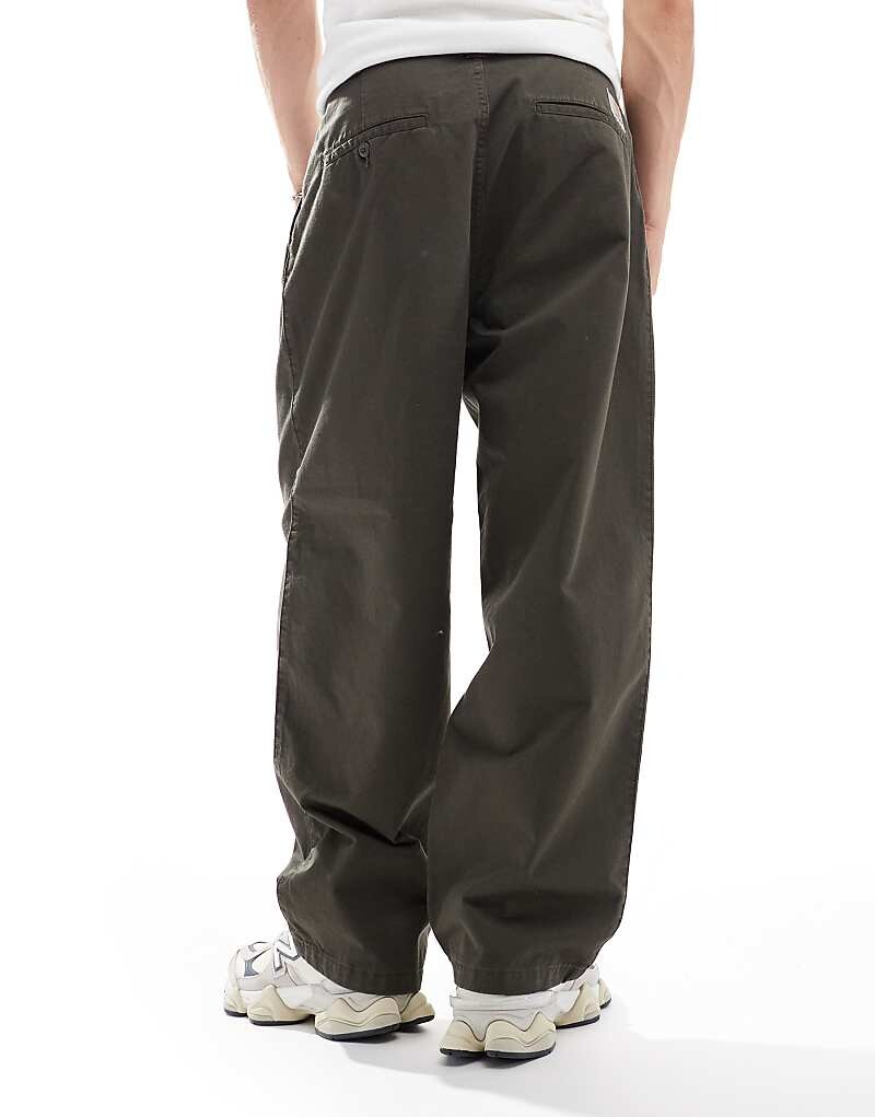 Carhartt WIP – Merrick – Зауженные зеленые брюки
Carhartt WIP – Merrick – Зауженные зеленые брюки