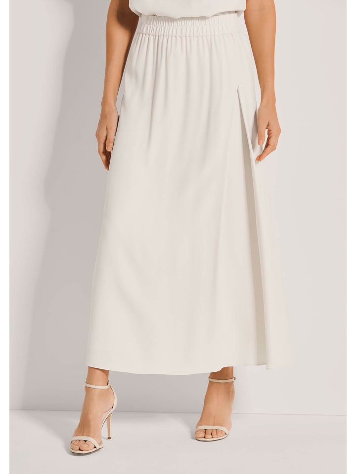 MADELEINE Длинная юбка с глубокой боковой складкой жемчужно-белого цвета
MADELEINE Длинная юбка с глубокой боковой складкой жемчужно-белого цвета