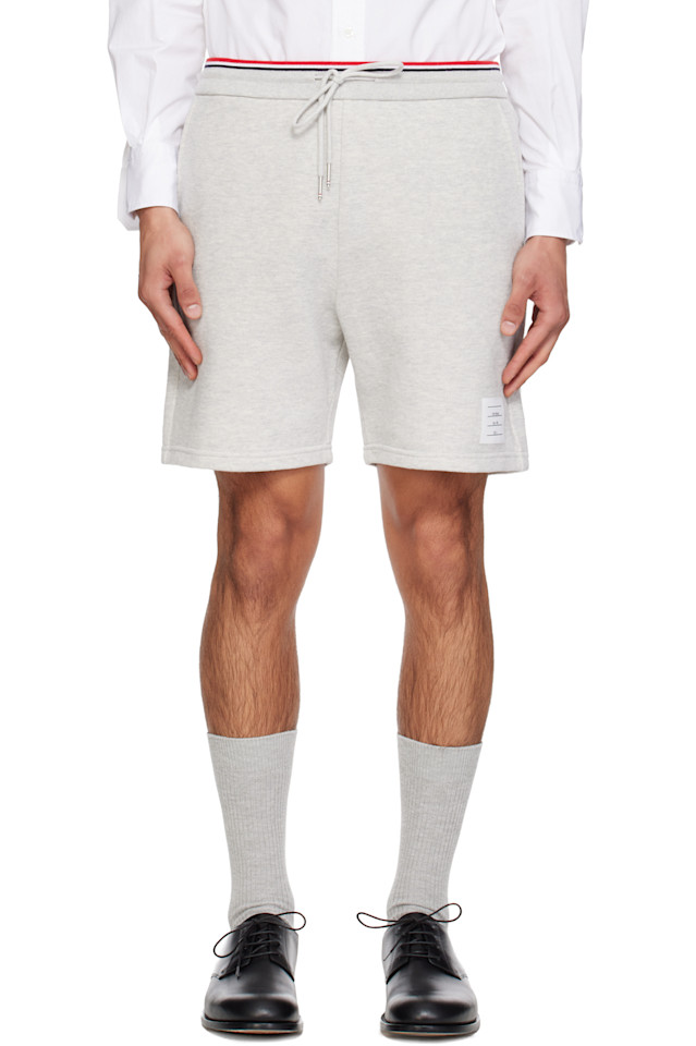 Thom Browne Серые спортивные шорты из пике с петлевой изнанкой
Thom Browne Серые спортивные шорты из пике с петлевой изнанкой