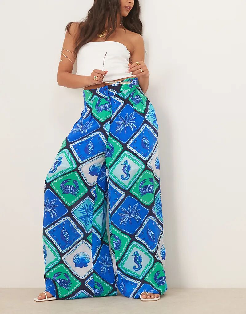 Брюки-палаццо Hope & Ivy с высокой талией и синим принтом ракушек
Брюки-палаццо Hope & Ivy с высокой талией и синим принтом ракушек