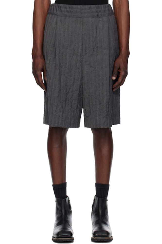 Темно-синие плиссированные шорты-бермуды Dries Van Noten
Темно-синие плиссированные шорты-бермуды Dries Van Noten