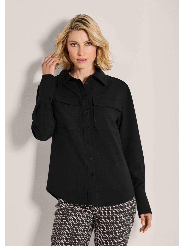 MADELEINE Элегантная блузка с воротником-стойкой черного цвета
MADELEINE Элегантная блузка с воротником-стойкой черного цвета