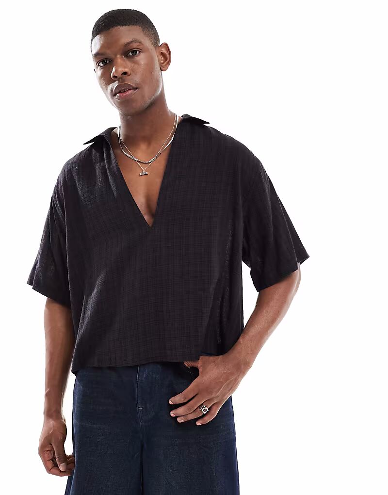 Рубашка свободного кроя ASOS DESIGN черного цвета с глубокими лацканами
Рубашка свободного кроя ASOS DESIGN черного цвета с глубокими лацканами