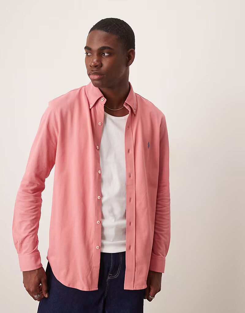 Рубашка из пике с логотипом Polo Ralph Lauren в розово-розовом цвете
Рубашка из пике с логотипом Polo Ralph Lauren в розово-розовом цвете