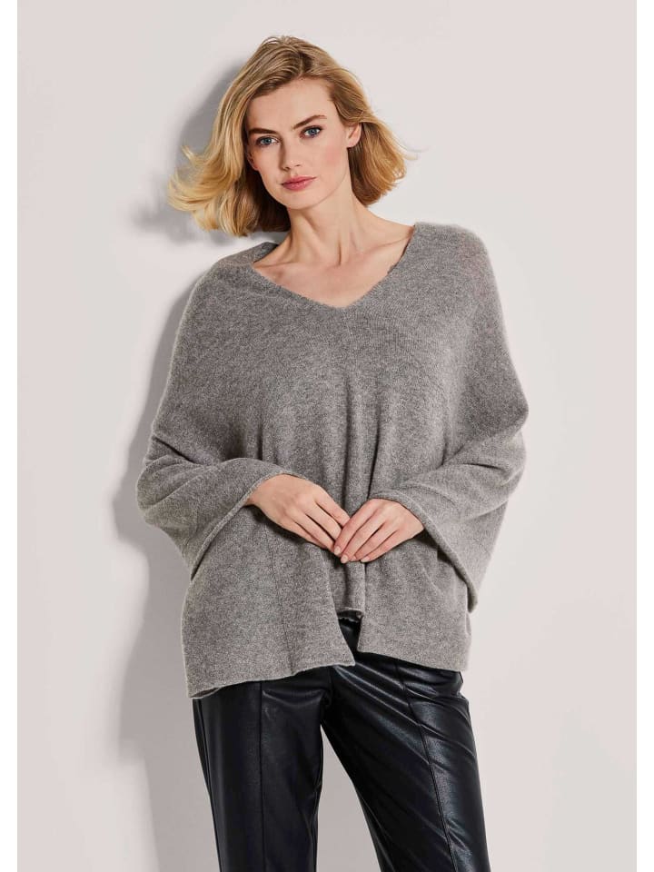 MADELEINE Элегантная кашемировая куртка-пончо серо-бежевого цвета с меланжевым эффектом
MADELEINE Элегантная кашемировая куртка-пончо серо-бежевого цвета с меланжевым эффектом