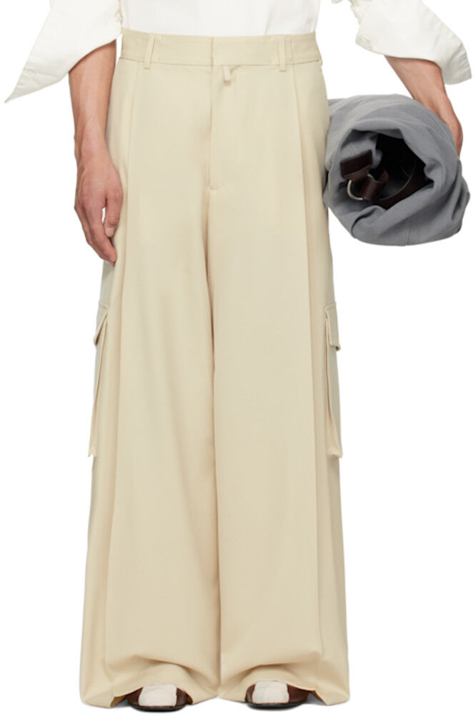 Бежевые широкие брюки со складками Dries Van Noten
Бежевые широкие брюки со складками Dries Van Noten