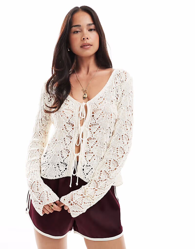 Мисс Селфридж вязаный крючком топ с завязками спереди и рукавами-фонариками кремового цвета Miss Selfridge
Мисс Селфридж вязаный крючком топ с завязками спереди и рукавами-фонариками кремового цвета Miss Selfridge