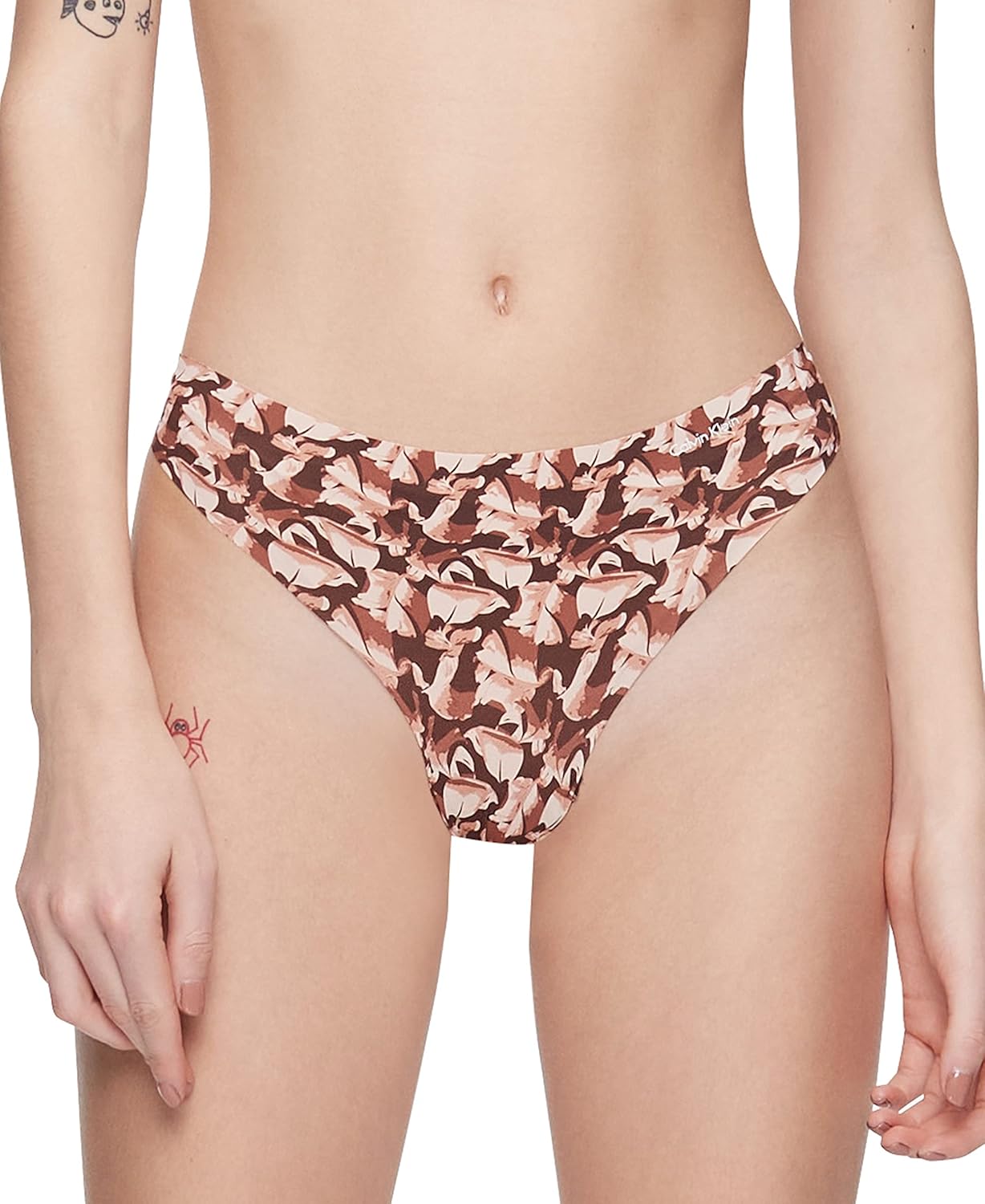 Бесшовные трусики-стринги Calvin Klein для женщин, Left Behind Print_Umber
Бесшовные трусики-стринги Calvin Klein для женщин, Left Behind Print_Umber