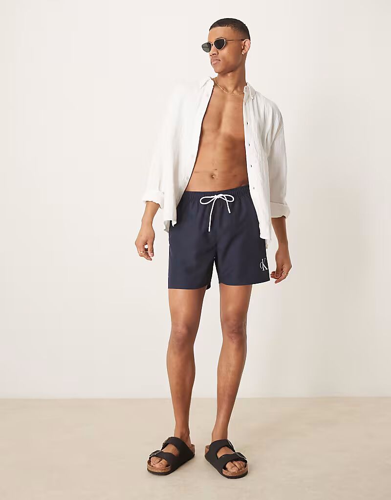 Шорты для плавания с логотипом Calvin Klein на шнурке темно-синего цвета
Шорты для плавания с логотипом Calvin Klein на шнурке темно-синего цвета