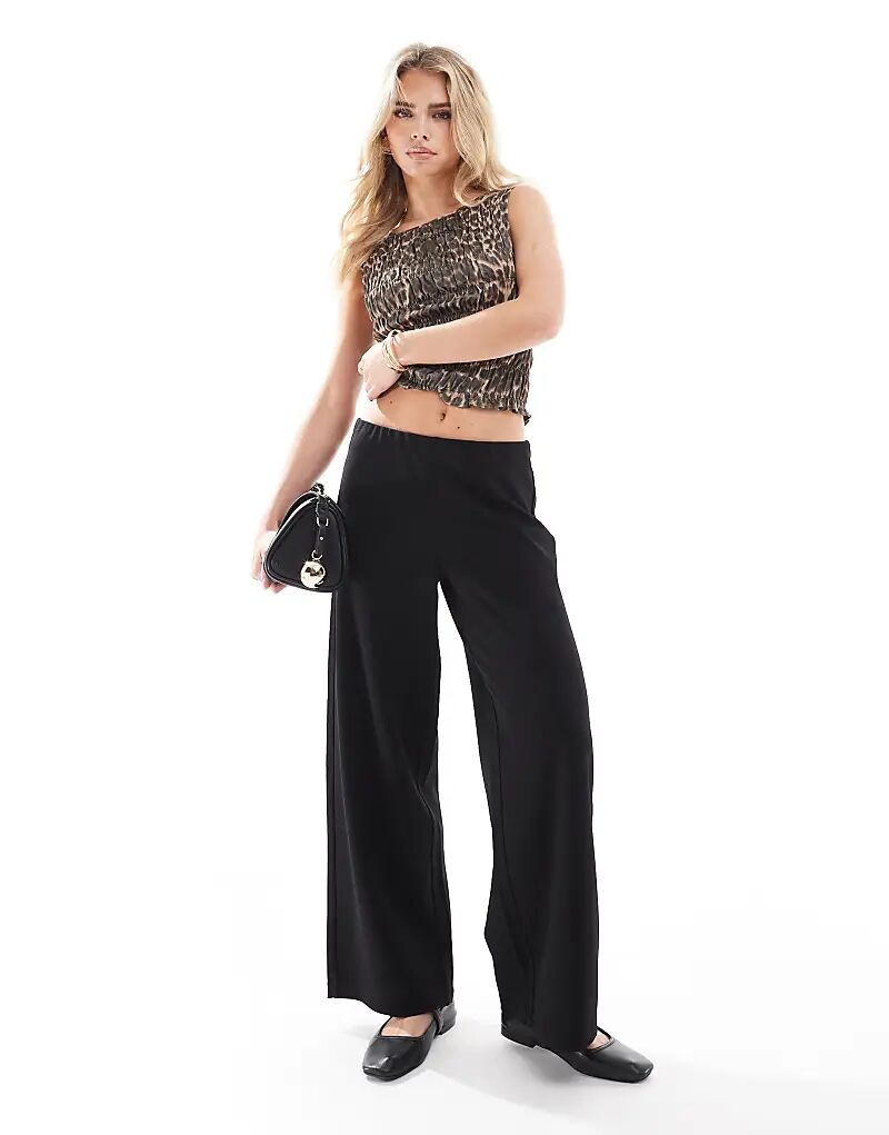 Брюки широкие из трикотажного крепа черного цвета Vero Moda
Брюки широкие из трикотажного крепа черного цвета Vero Moda